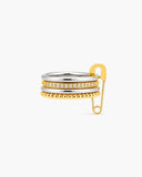 Phoebe mixed-metal stacked ring with clear stones and an oversized gold safety-pin accent on a white background.