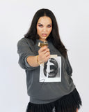 Model wearing the washed charcoal Sorry I’m a Fire Sign crewneck sweatshirt.
