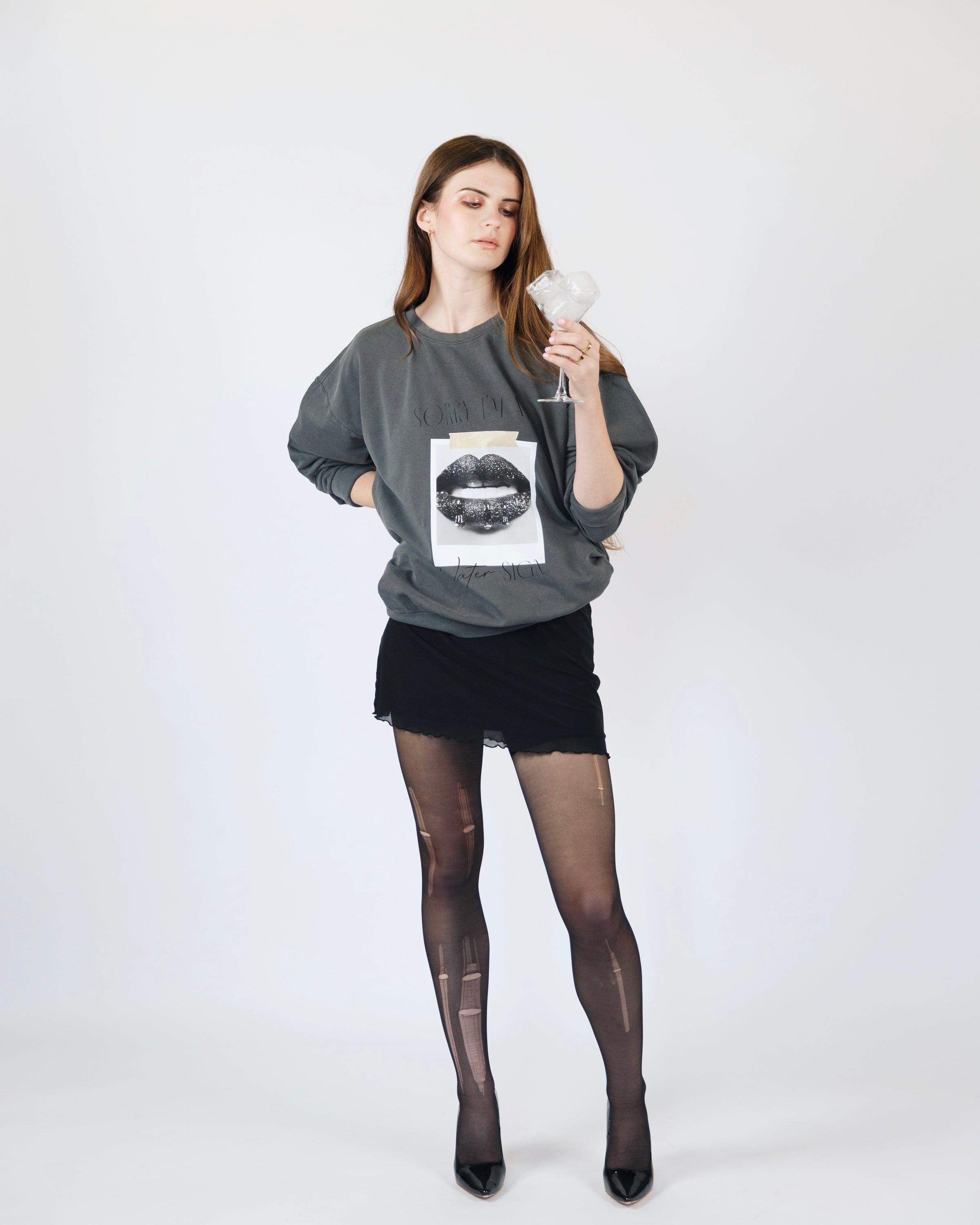 Additional full-body model view of the washed charcoal Sorry I’m a Water Sign crewneck sweatshirt.