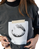 Washed charcoal crewneck sweatshirt reading Sorry I’m an Air Sign with a black-and-white lips graphic.