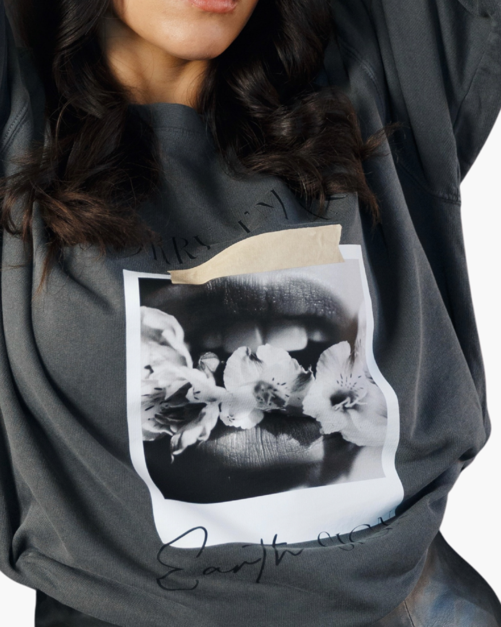 Washed charcoal crewneck sweatshirt reading Sorry I’m an Earth Sign with a black-and-white floral lips graphic.