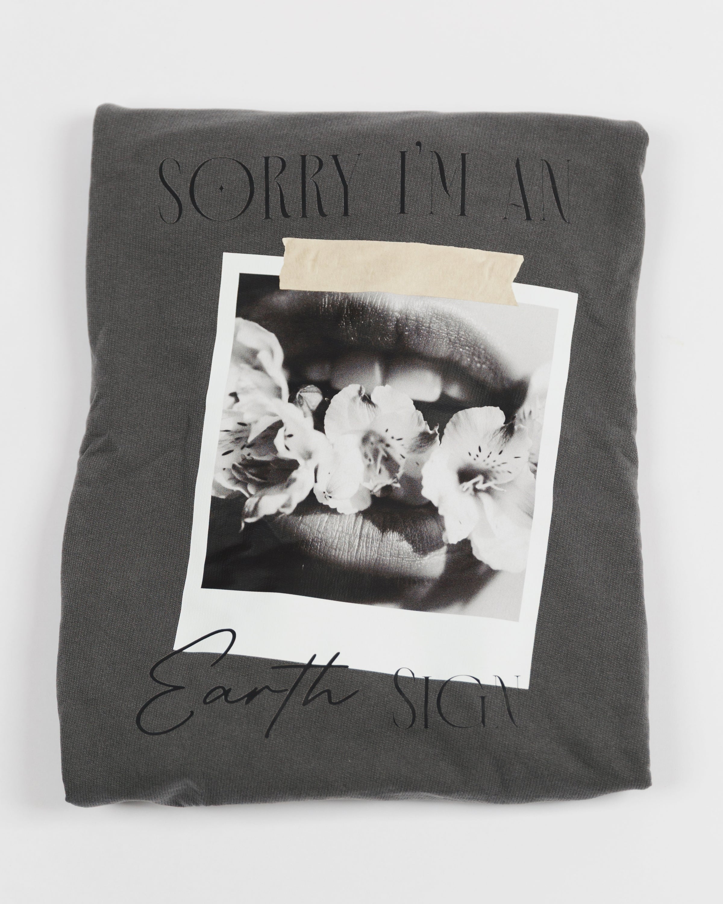 Folded washed charcoal Sorry I’m an Earth Sign crewneck sweatshirt.