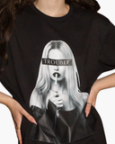 Black crewneck T-shirt with a black-and-white portrait and TROUBLE printed across the eyes.