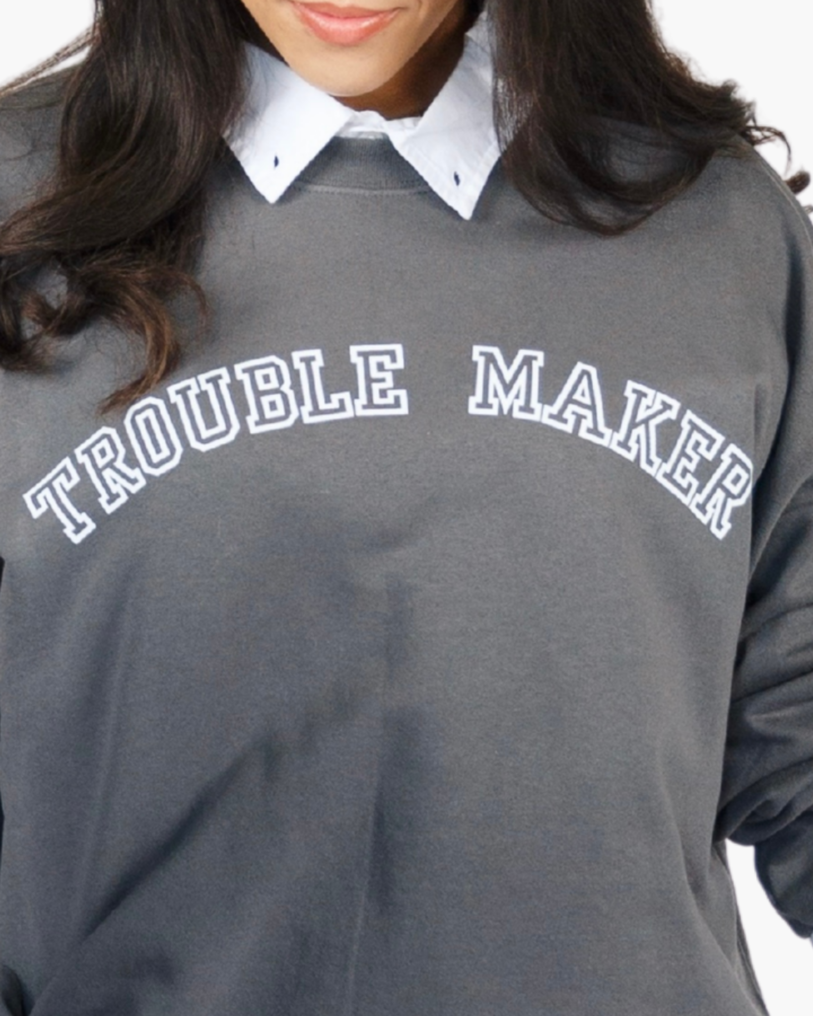 Charcoal crewneck sweatshirt with white collegiate text reading Trouble Maker.