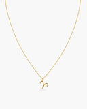 Gold-tone Aries zodiac pendant necklace on a fine adjustable chain.