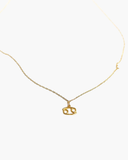Gold-tone Cancer zodiac pendant necklace on a fine adjustable chain.