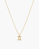 Gold-tone Gemini zodiac pendant necklace on a fine adjustable chain.