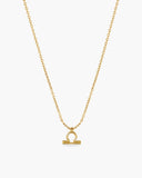 Gold-tone Libra zodiac pendant necklace on a fine adjustable chain.