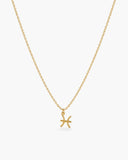 Gold-tone Pisces zodiac pendant necklace on a fine adjustable chain.